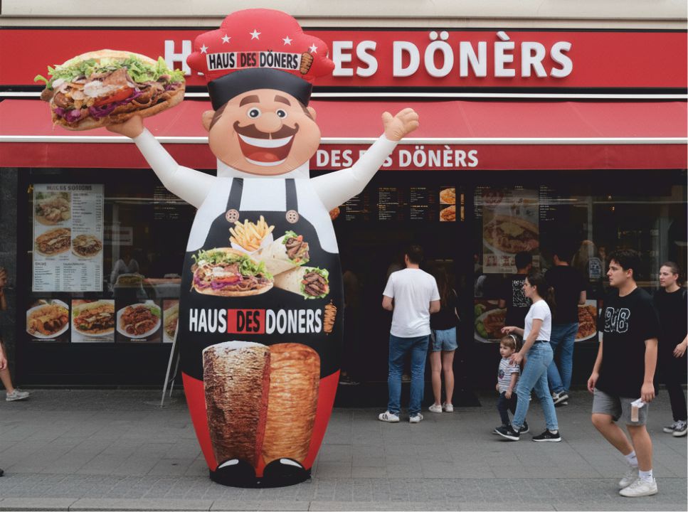 Custom inflatable logo balloon used in outdoor event promotion